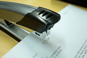 A photo of a staple that didn't staple the papers right